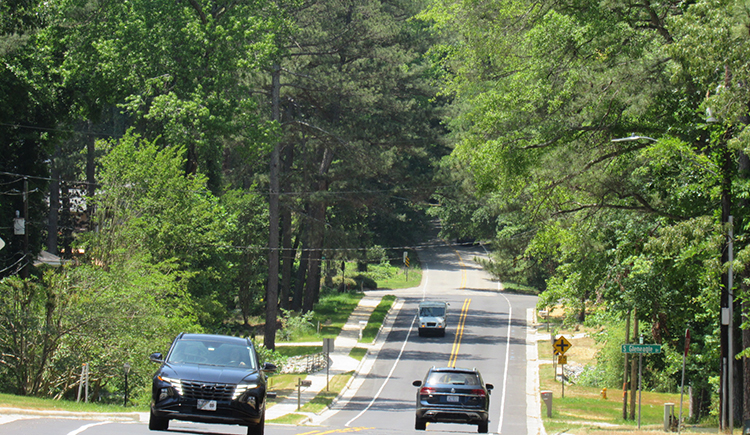 Motorists drive on a road that was improved with funds from the Powell Bill Program.