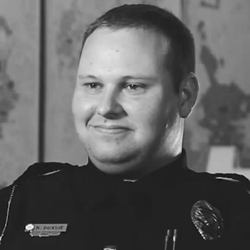 Photo of Ryne Doxsie. Click to watch video.