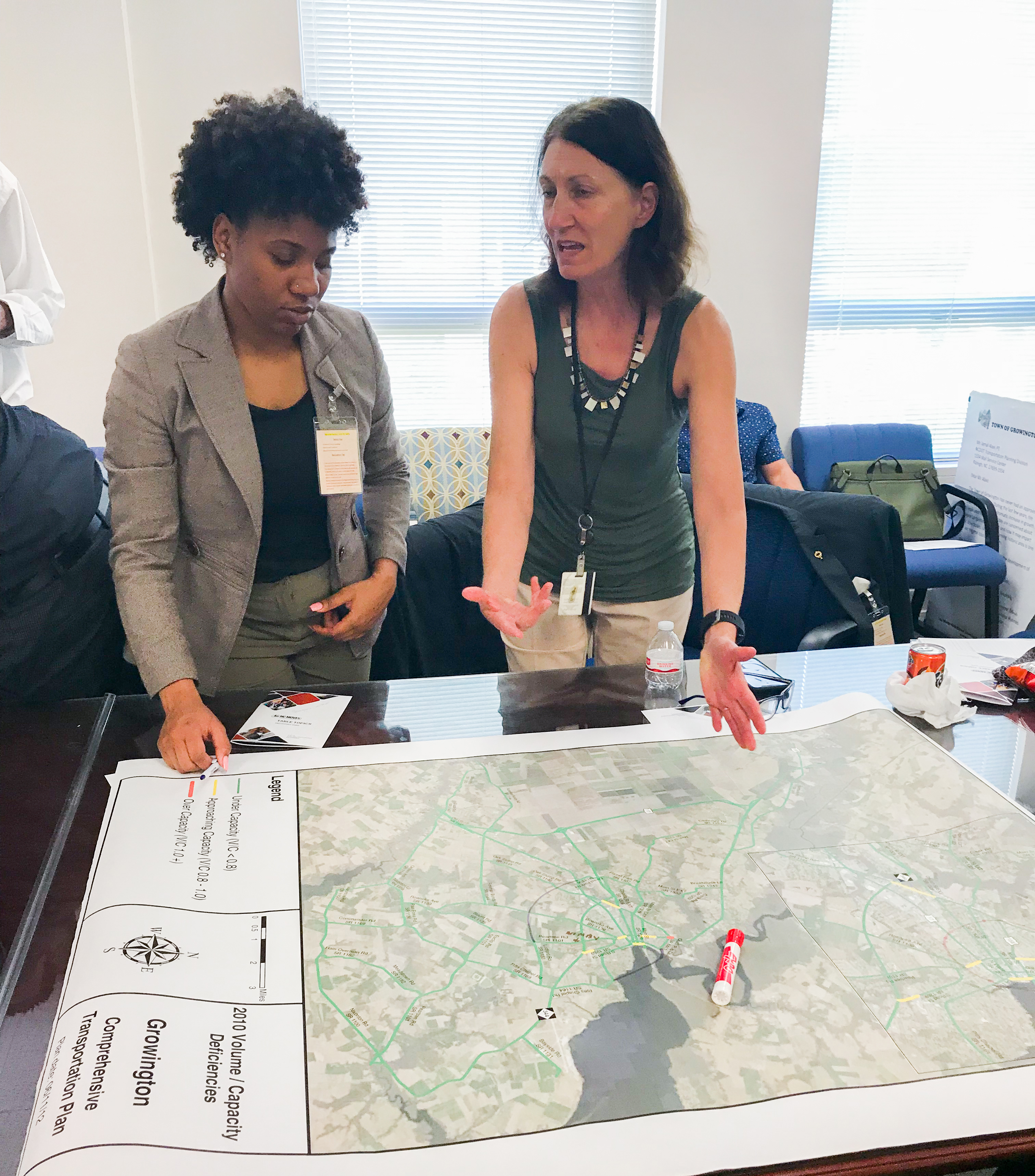 An NCDOT HBCU fellow speaks to a staff person about a project