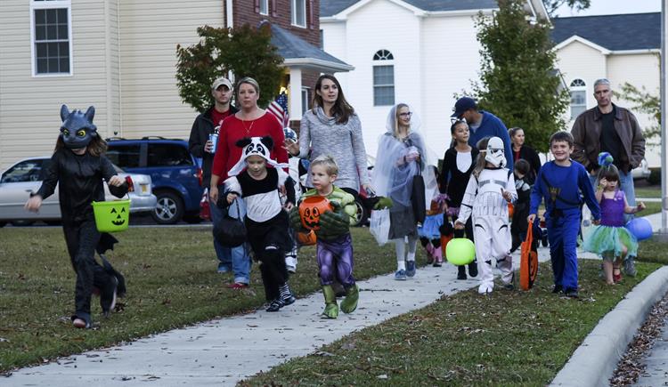 Children go trick-or-treating on Halloween