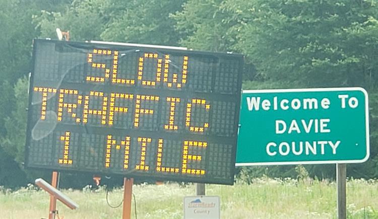 Message board says Slow Traffic 1 mile