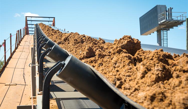 A conveyor belt hauls dirt over I-95 in Robeson County