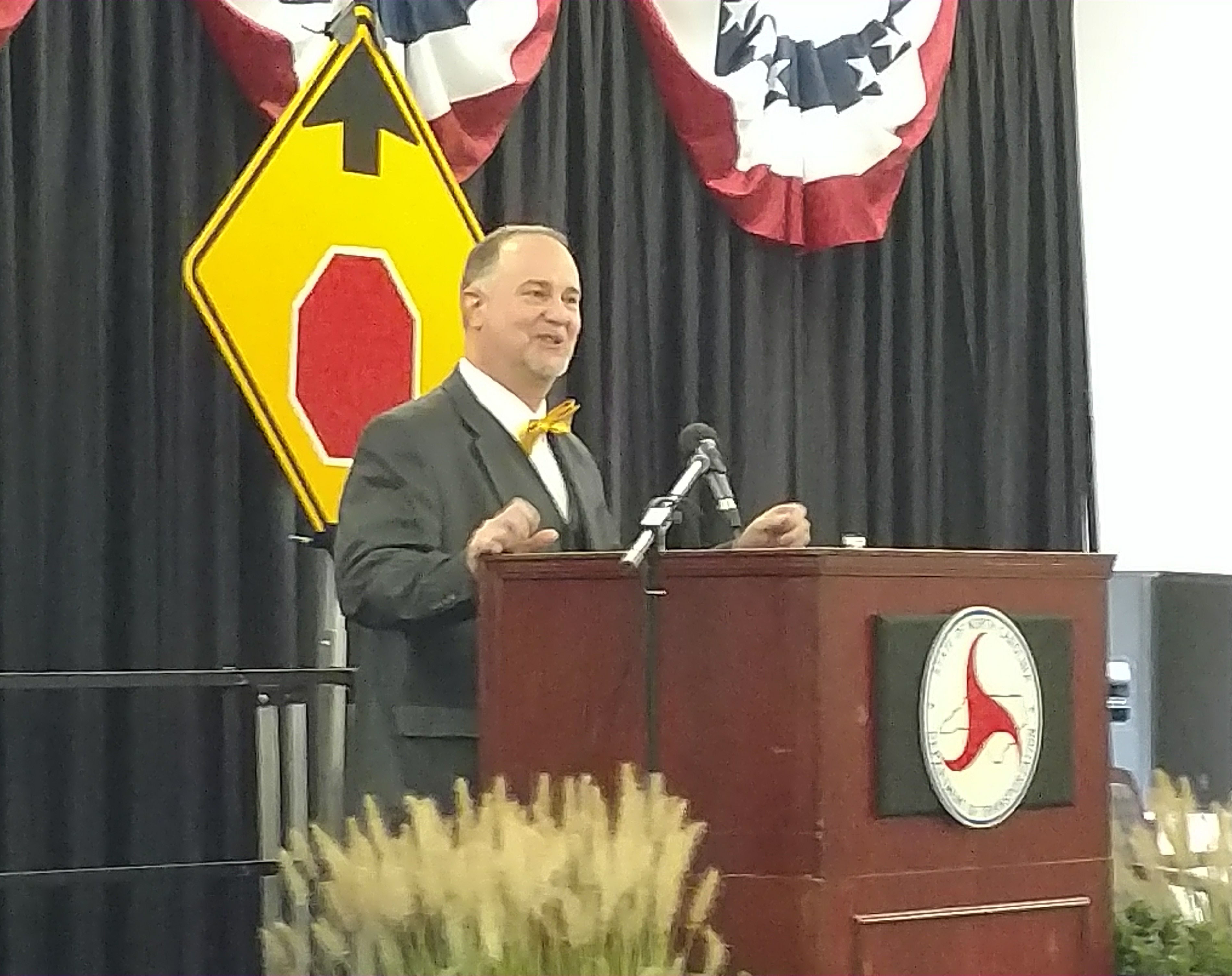 NCDOT Secretary Eric Boyette speaks to the crowd during the dedication ceremony for the Gus Tulloss Bridge. 