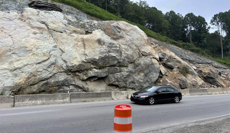 A black car drives along N.C. 105 near Broadstone Road. 