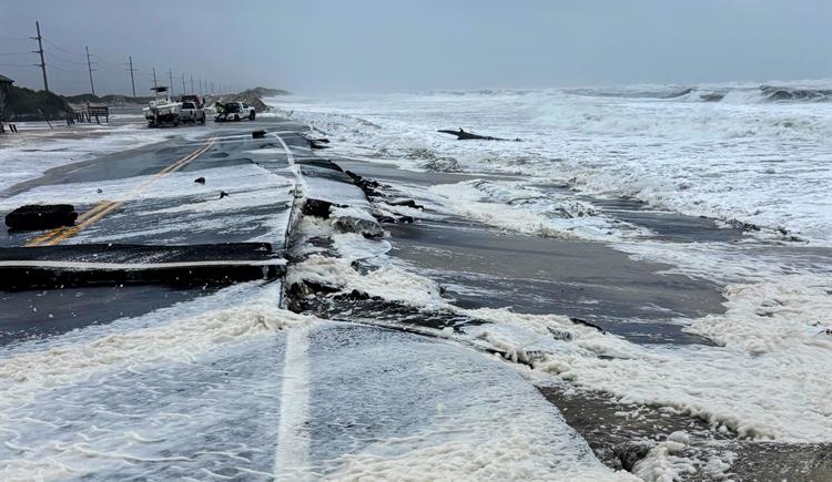 Parts of N.C. 12 are cracked and broken along the coast of Pea Island as ocean over washes the road.