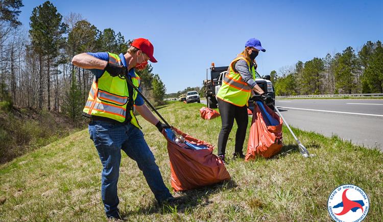 N.C. Board of Transportation Division 8 Representative Lisa Mathis and Division Engineer Brandon Jones pick up trash in Sanford.